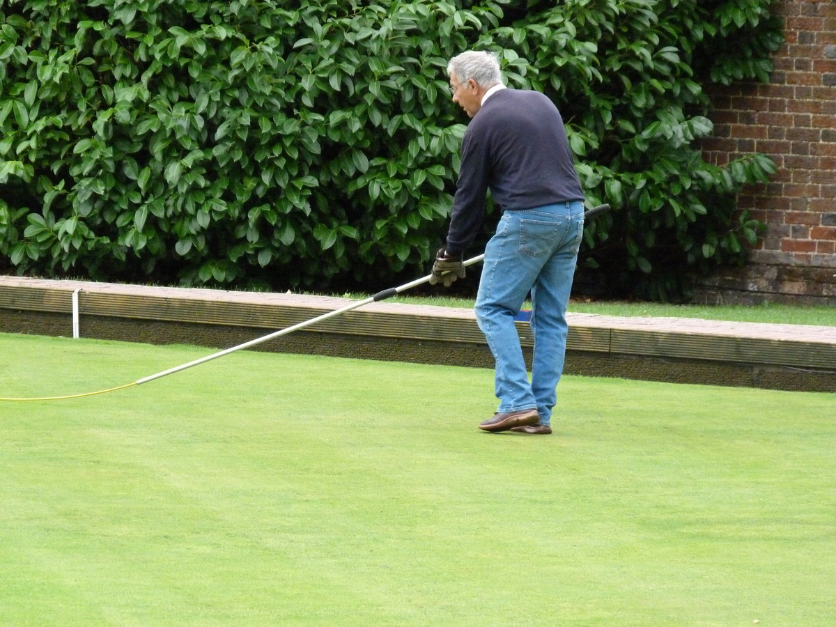 Peter Burgess using a rather unusual golf club !